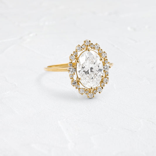 Graduated Halo-Oval Lab Grown Diamond Engagement Ring