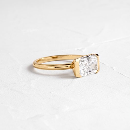 East West Solitaire Half Bezel-Radiant Lab Grown Diamond Engagement Ring