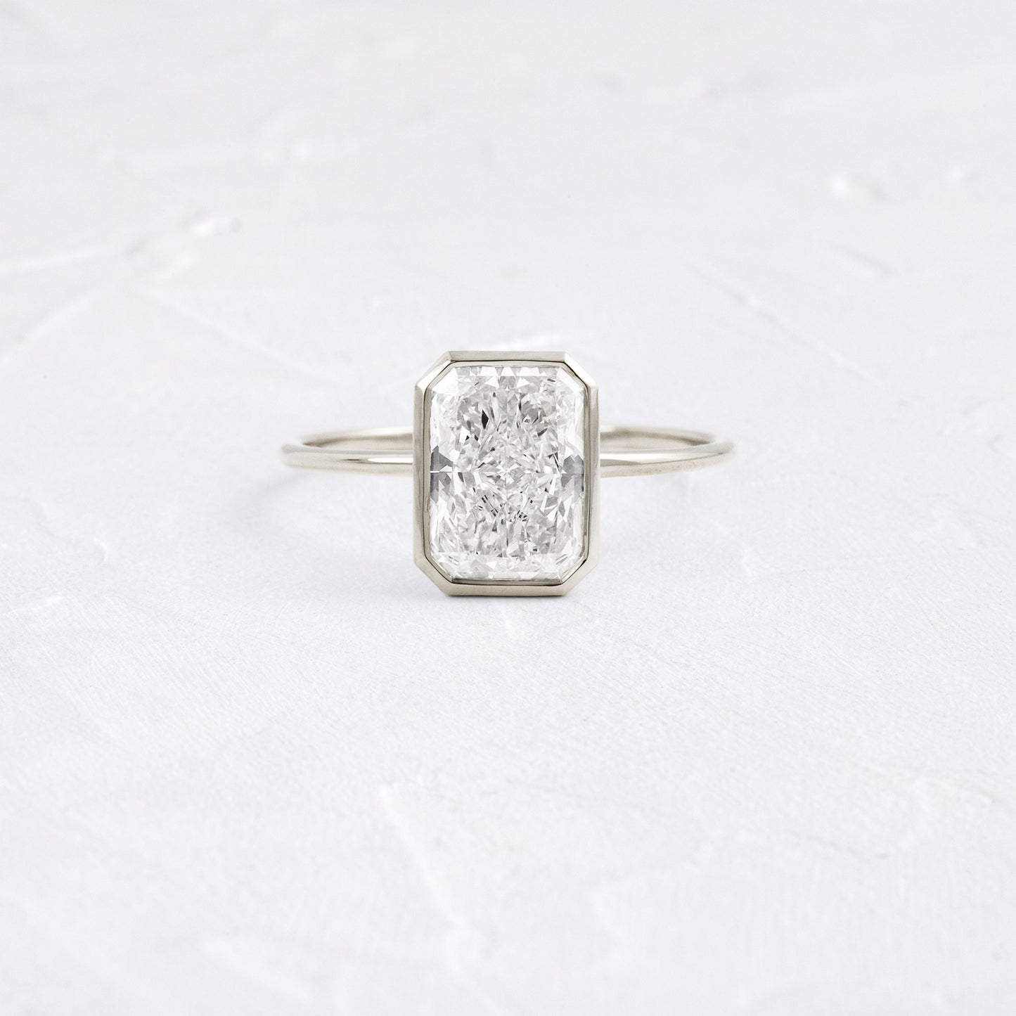 Solitaire Bezel with Hidden Stone-Radiant Lab Grown Diamond Engagement Ring