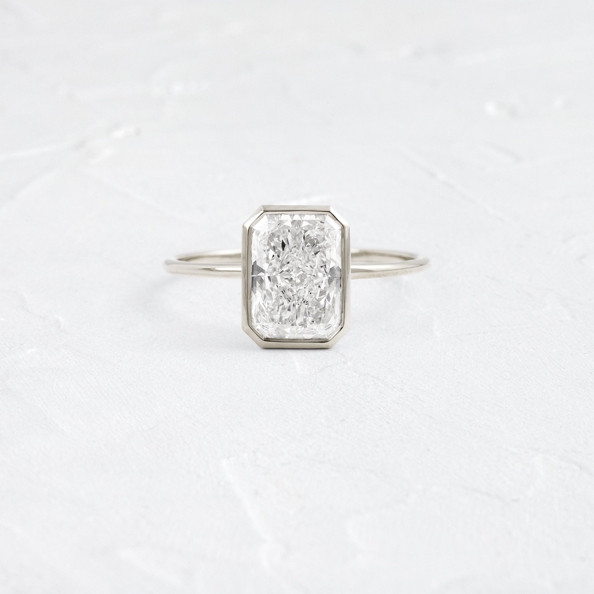 Solitaire Bezel with Hidden Stone-Radiant Lab Grown Diamond Engagement Ring