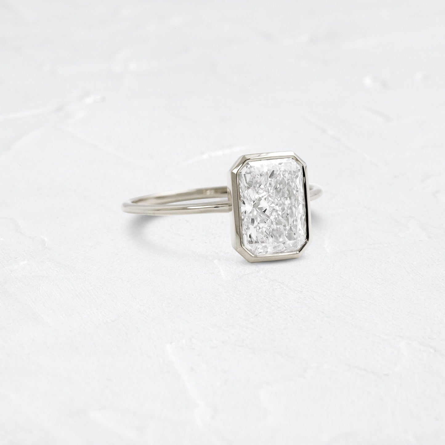 Solitaire Bezel with Hidden Stone-Radiant Lab Grown Diamond Engagement Ring