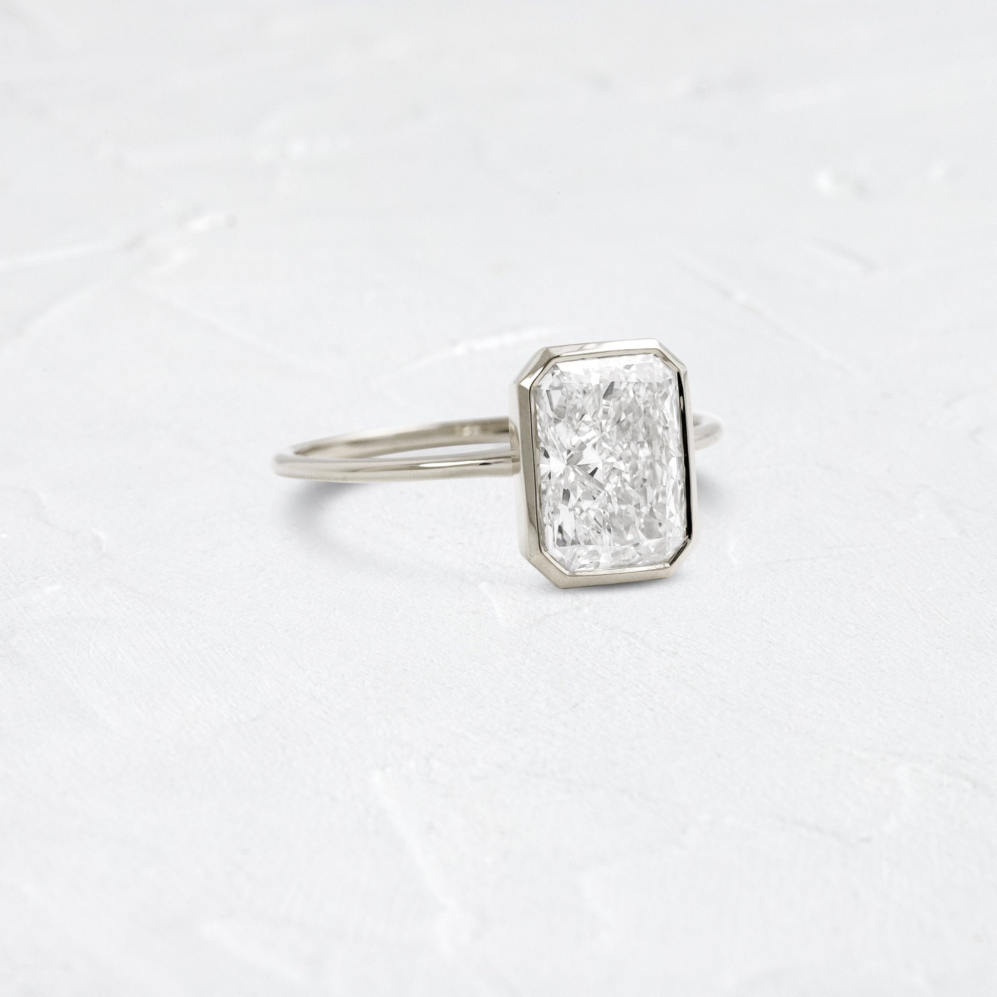 Solitaire Bezel with Hidden Stone-Radiant Lab Grown Diamond Engagement Ring