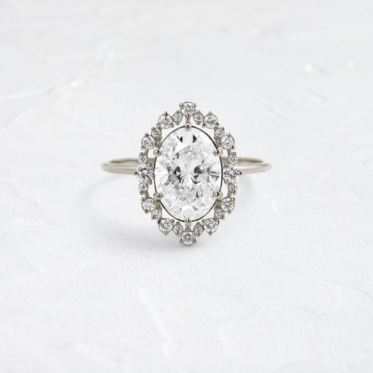Graduated Halo-Oval Lab Grown Diamond Engagement Ring
