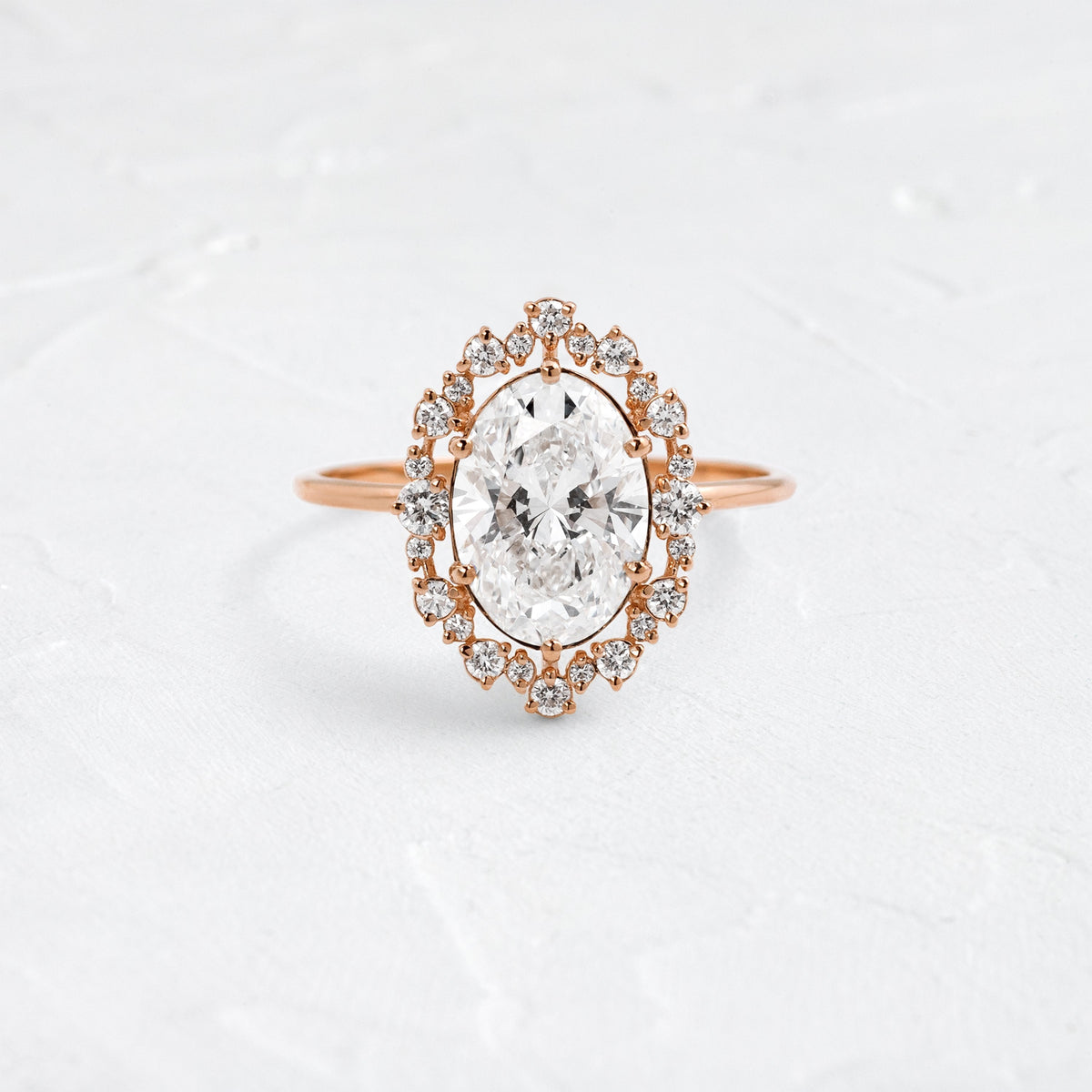 Graduated Halo-Oval Lab Grown Diamond Engagement Ring