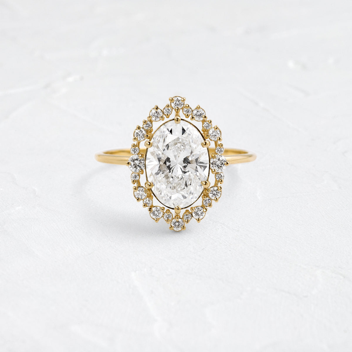 Graduated Halo-Oval Lab Grown Diamond Engagement Ring