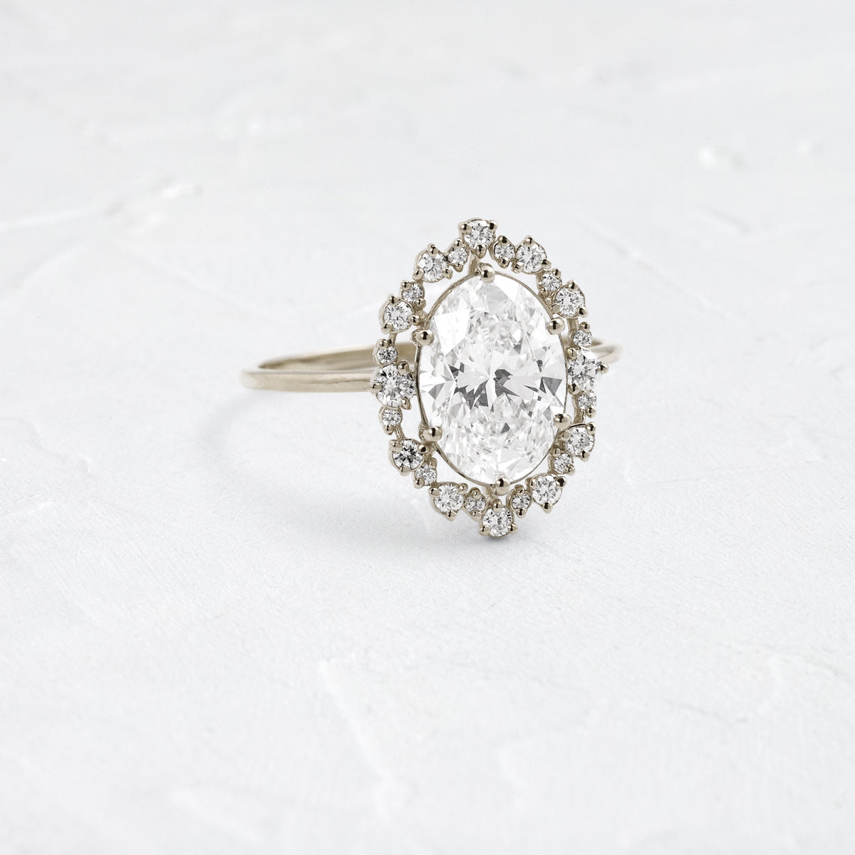 Graduated Halo-Oval Lab Grown Diamond Engagement Ring