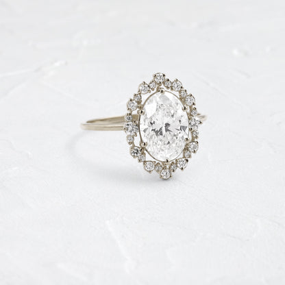Graduated Halo-Oval Lab Grown Diamond Engagement Ring
