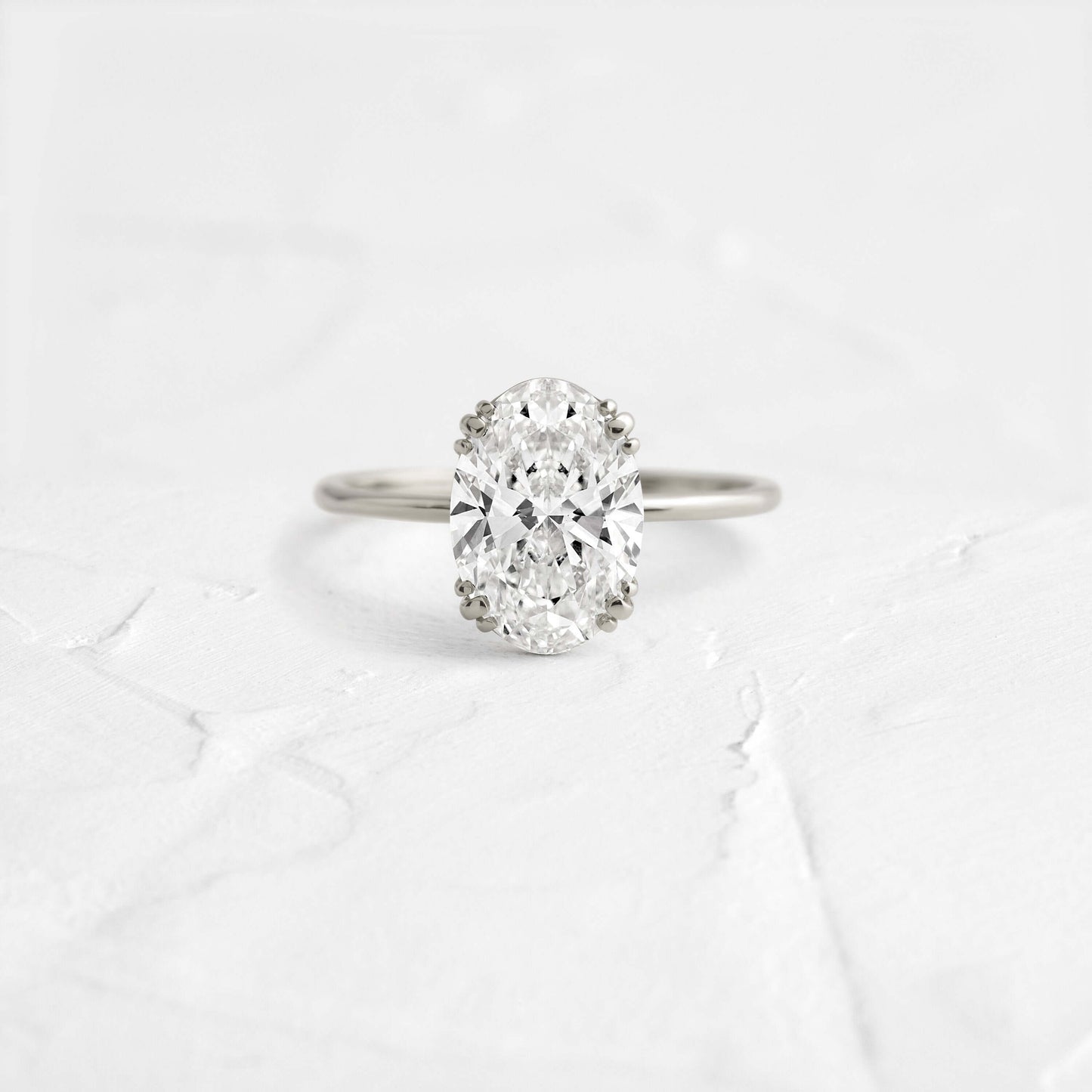 Solitaire Triple Prong with Hidden Stones-Oval Lab Grown Diamond Engagement Ring