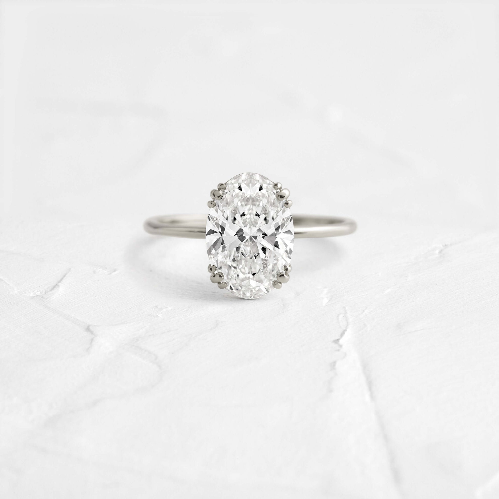 Solitaire Triple Prong with Hidden Stones-Oval Lab Grown Diamond Engagement Ring