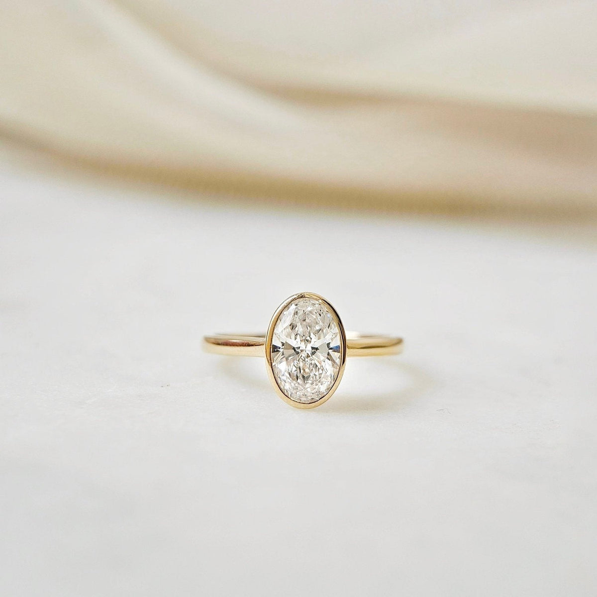 Solitaire Bezel-2.0 CT Oval Lab Grown Diamond Engagement Ring