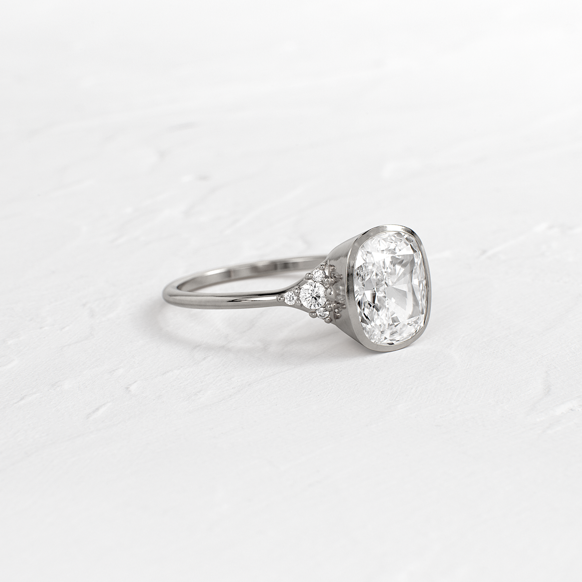 Bezel & Cluster Style-Elongated Cushion Lab Grown Diamond Engagement Ring