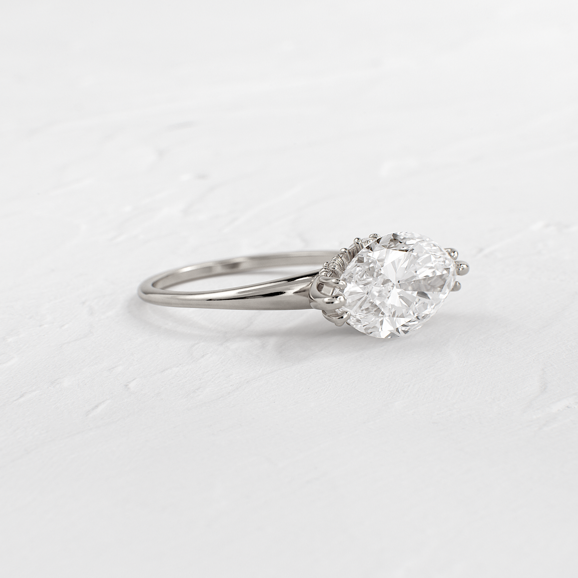 East West Solitaire with Hidden Stones-Marquise Lab Grown Diamond Engagement Ring