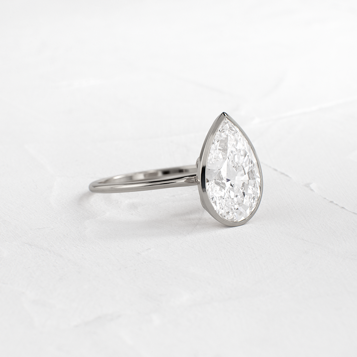 Solitaire Bezel with Hidden Stones-Pear Lab Grown Diamond Engagement Ring