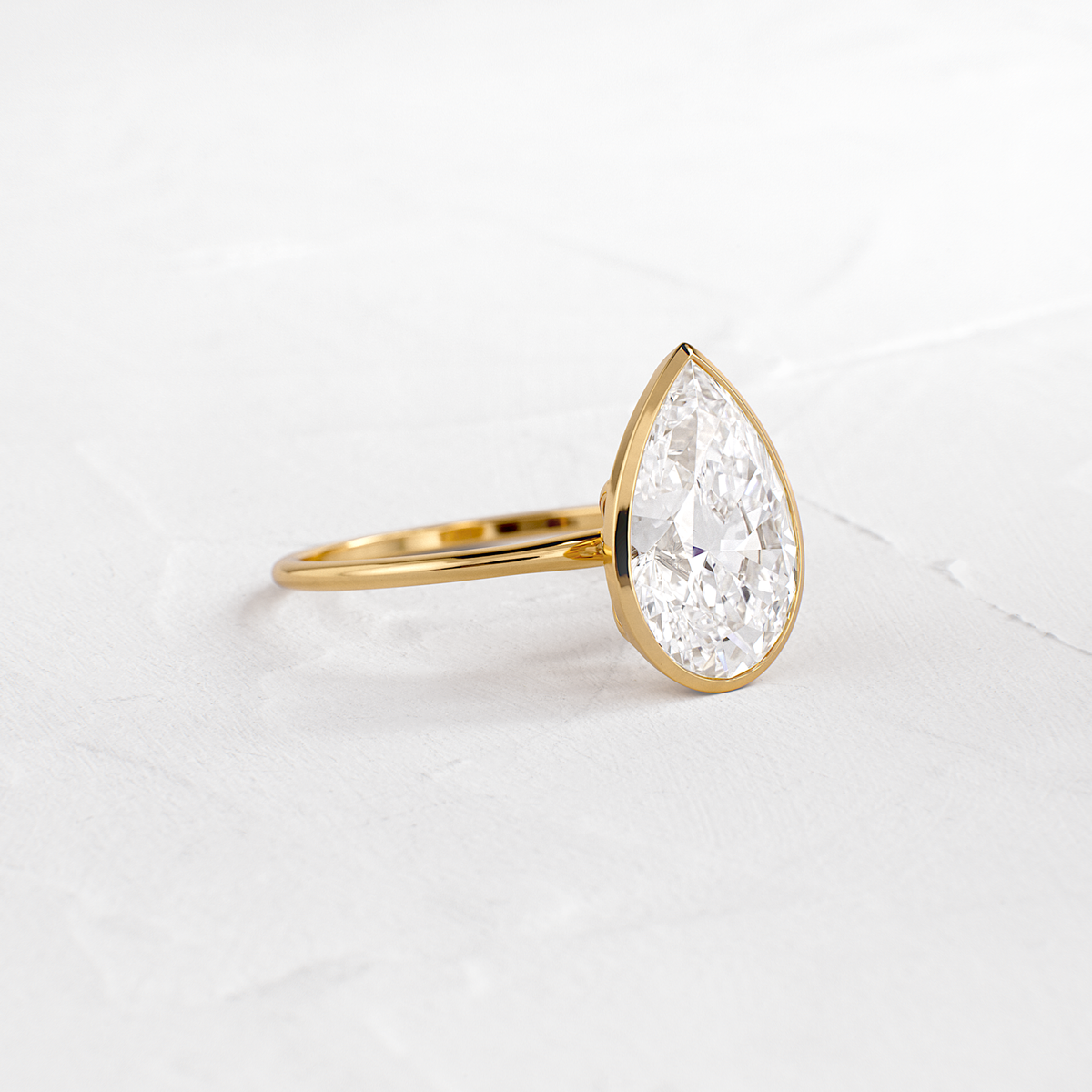 Solitaire Bezel with Hidden Stones-Pear Lab Grown Diamond Engagement Ring