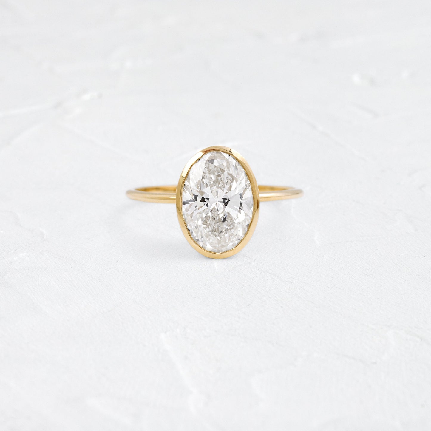 Bezel Hidden Stone-Oval Lab Grown Diamond Engagement Ring