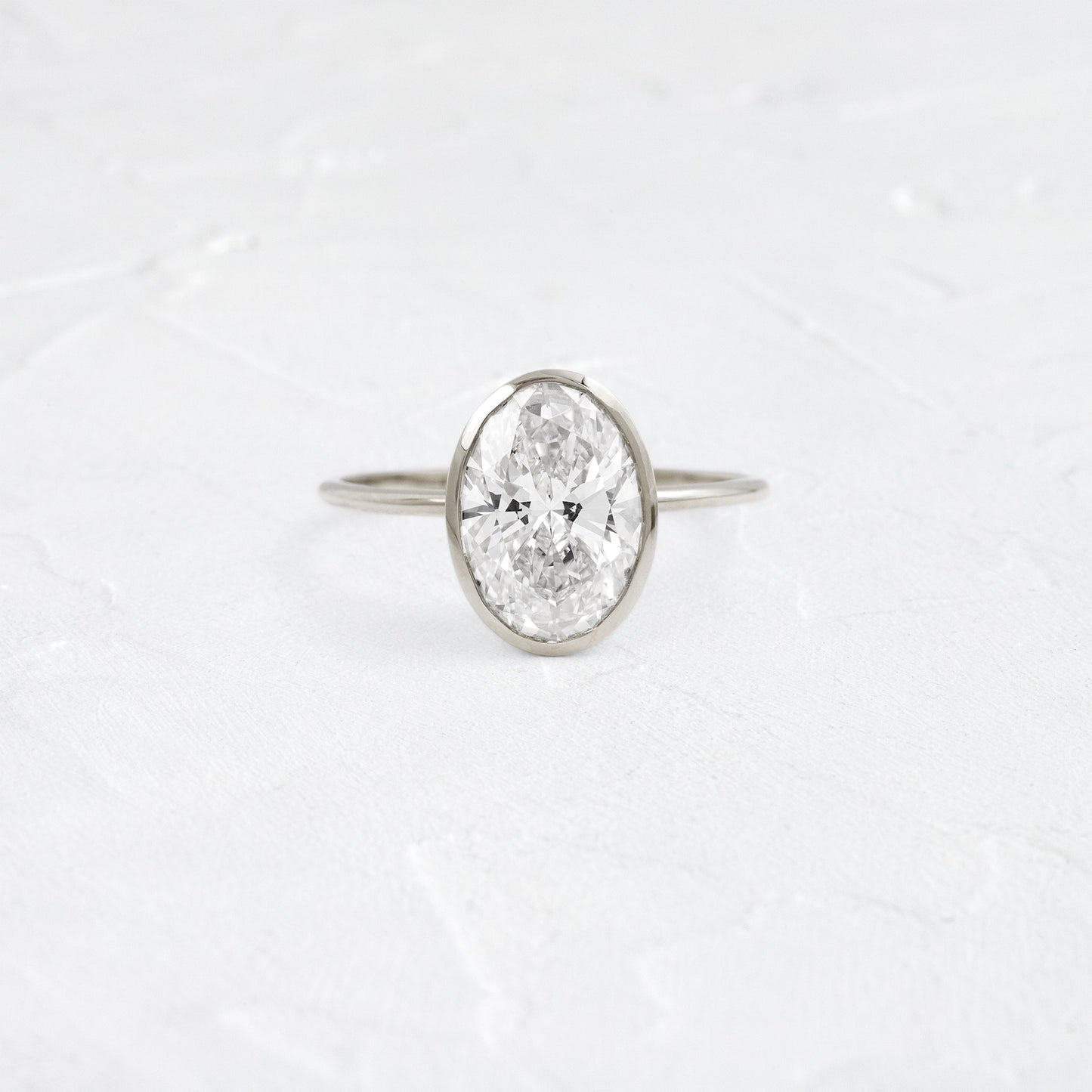 Bezel with Hidden Stones-Oval Lab Grown Diamond Engagement Ring