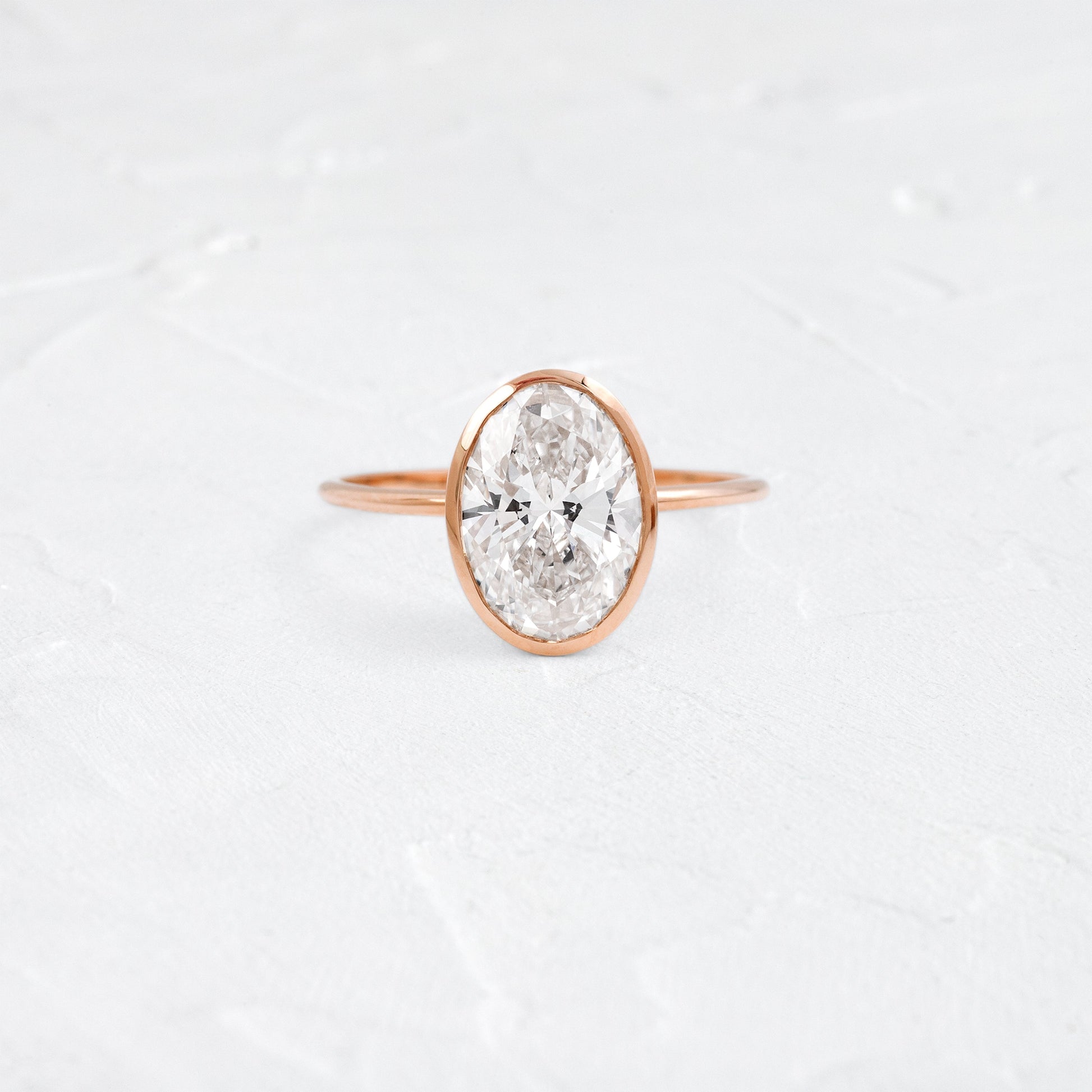 Bezel with Hidden Stones-Oval Lab Grown Diamond Engagement Ring