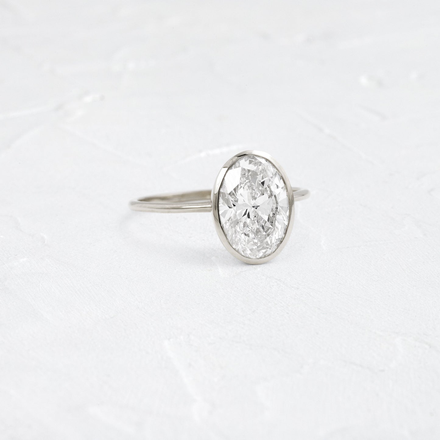 Bezel with Hidden Stones-Oval Lab Grown Diamond Engagement Ring