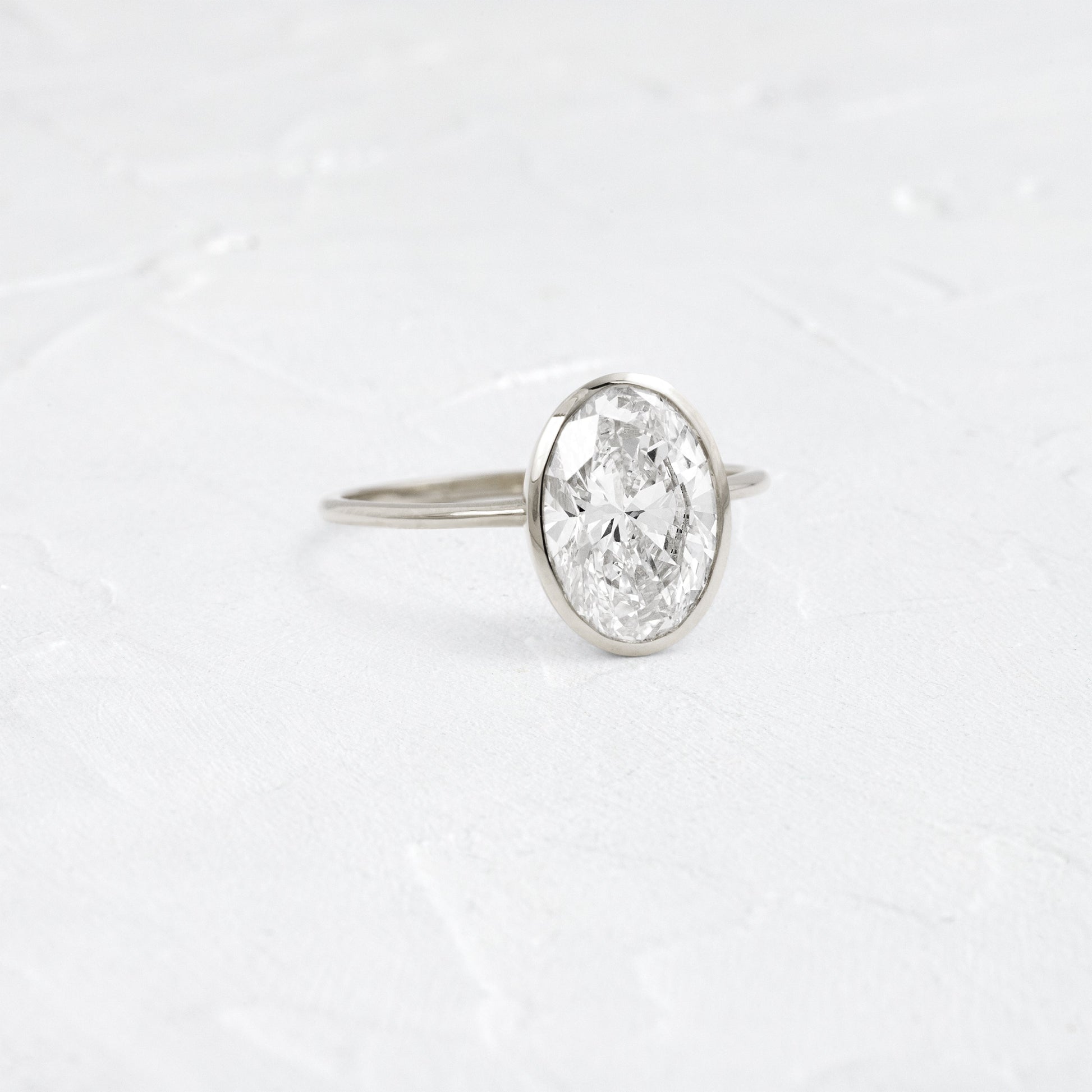 Bezel with Hidden Stones-Oval Lab Grown Diamond Engagement Ring