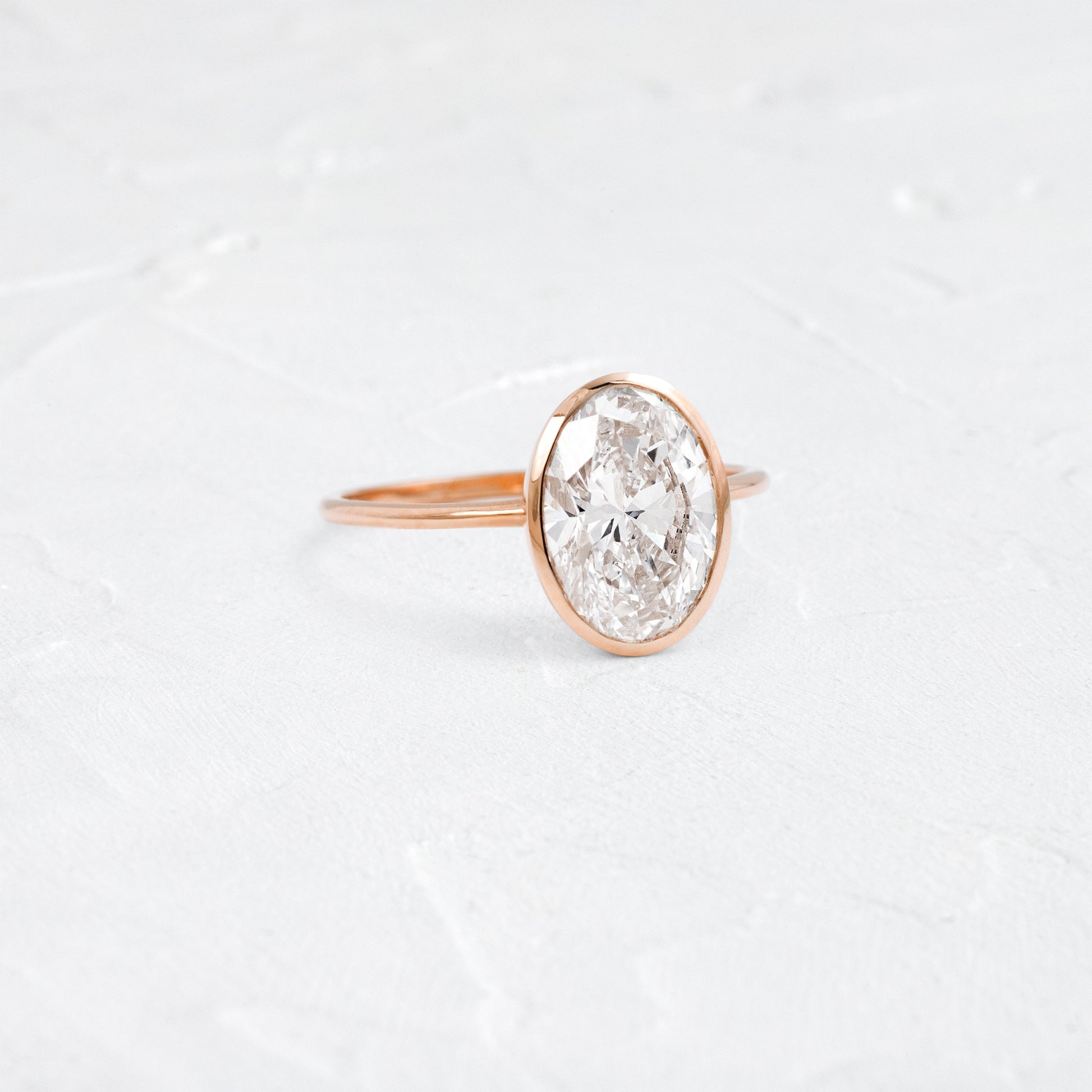 Bezel with Hidden Stones-Oval Lab Grown Diamond Engagement Ring
