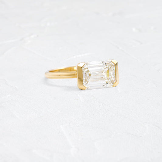 East West Solitaire Half Bezel-Emerald Lab Grown Diamond Engagement Ring