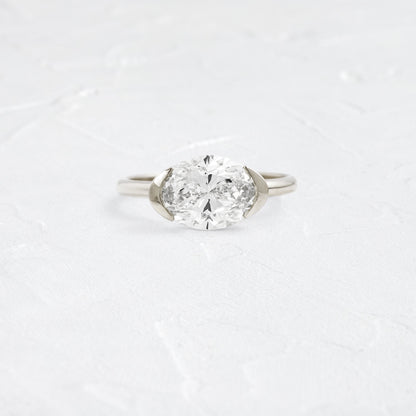 East West Solitaire Half Bezel-Oval Lab Grown Diamond Engagement Ring