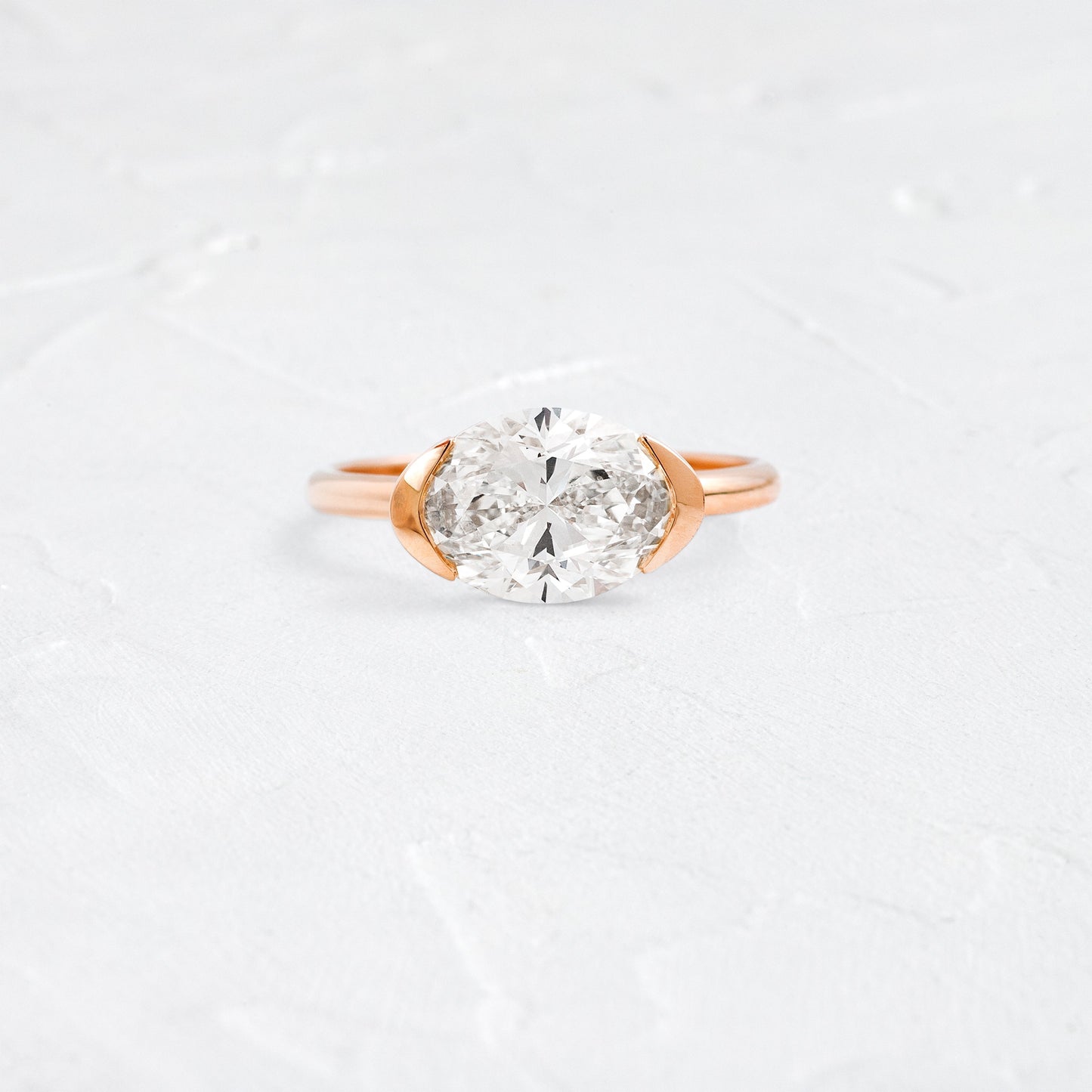 East West Solitaire Half Bezel-Oval Lab Grown Diamond Engagement Ring