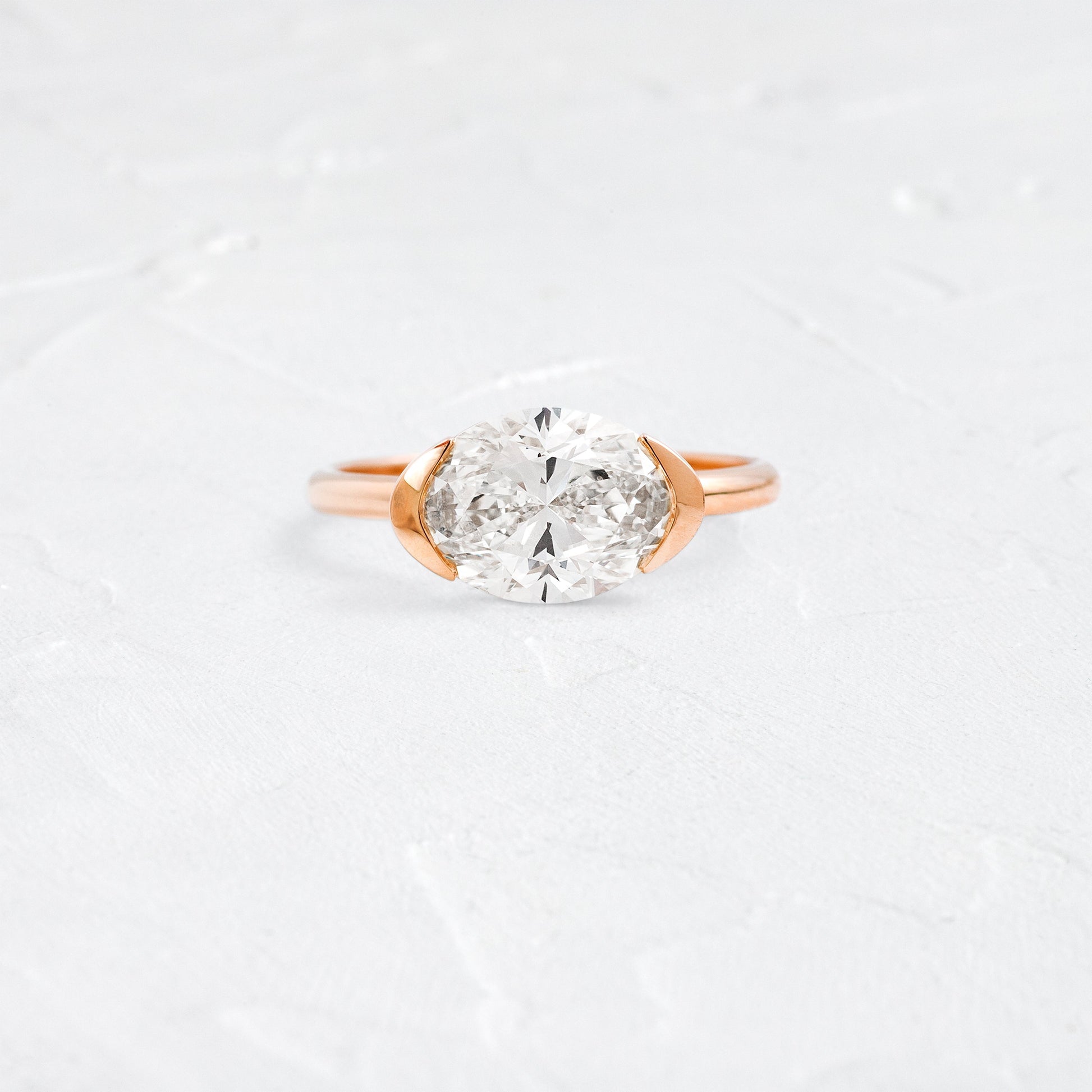 East West Solitaire Half Bezel-Oval Lab Grown Diamond Engagement Ring