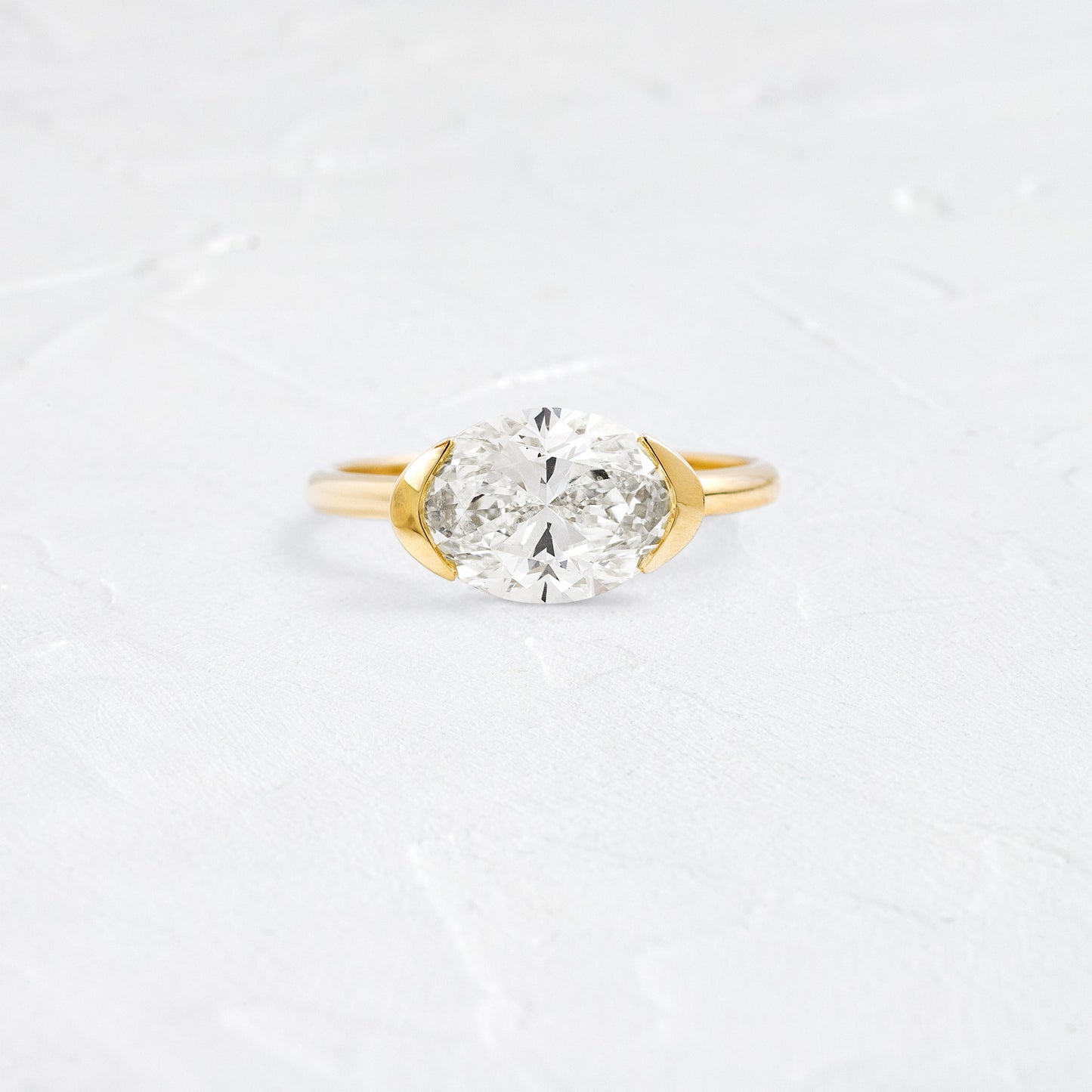 East West Solitaire Half Bezel-Oval Lab Grown Diamond Engagement Ring