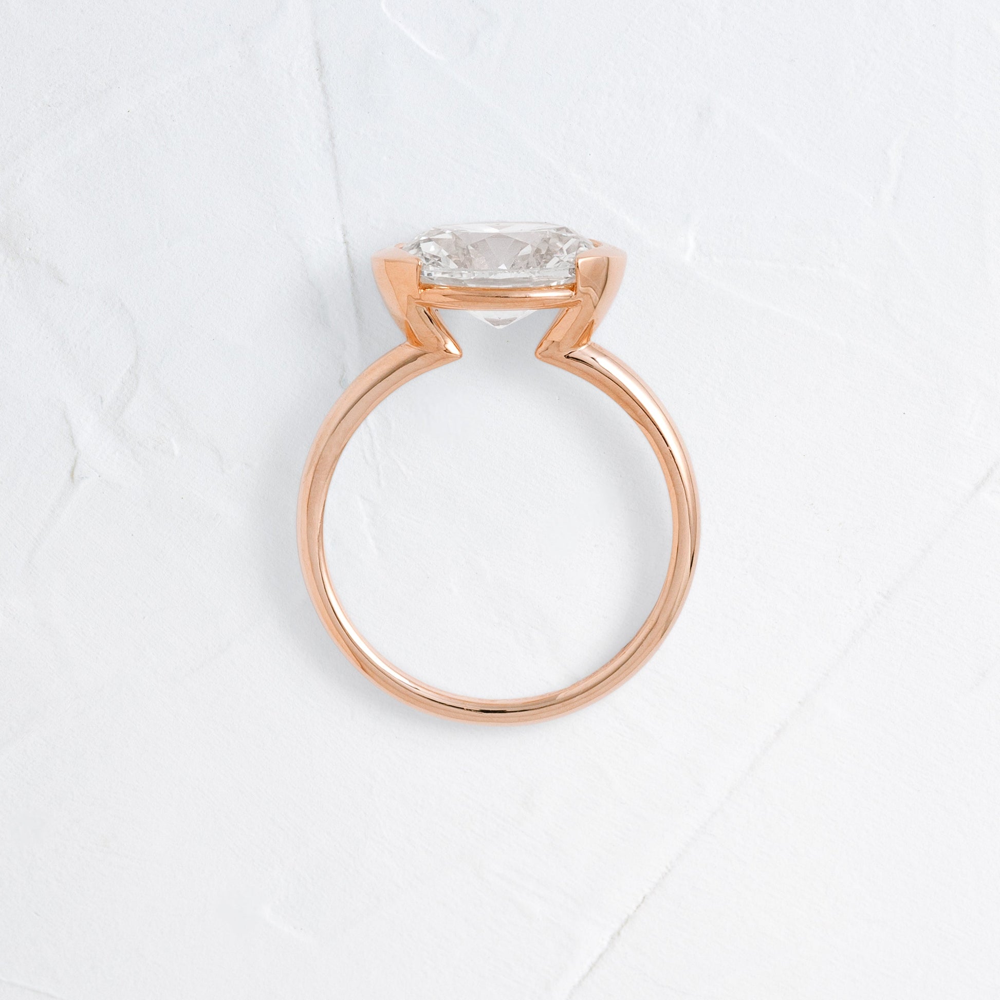 East West Solitaire Half Bezel-Oval Lab Grown Diamond Engagement Ring