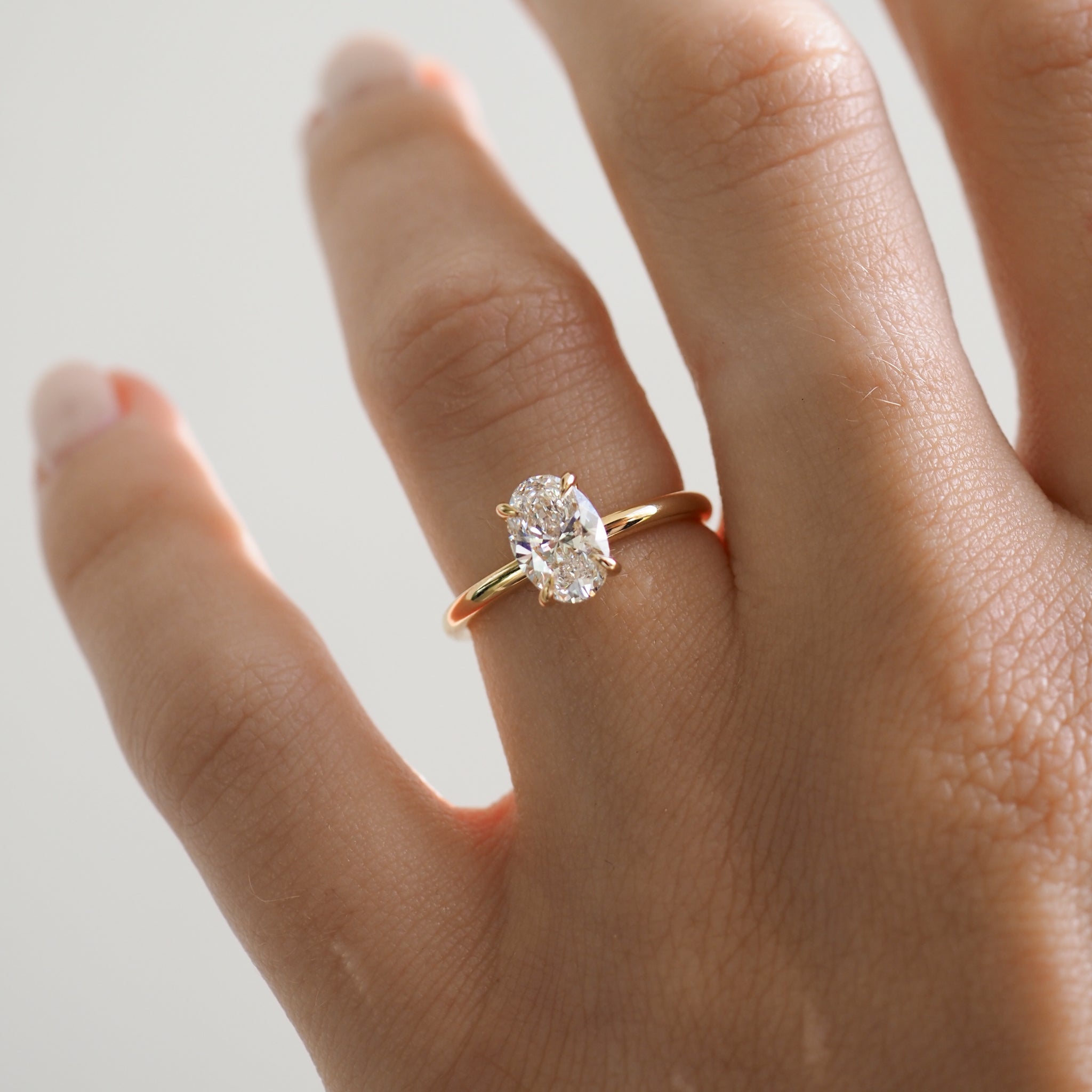 1.0 CT Oval Lab Grown Diamond Solitaire Engagement Ring in Classic Gold Setting