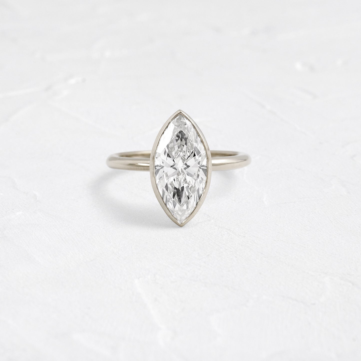Solitaire Bezel with Hidden Stones-Marquise Lab Grown Diamond Engagement Ring