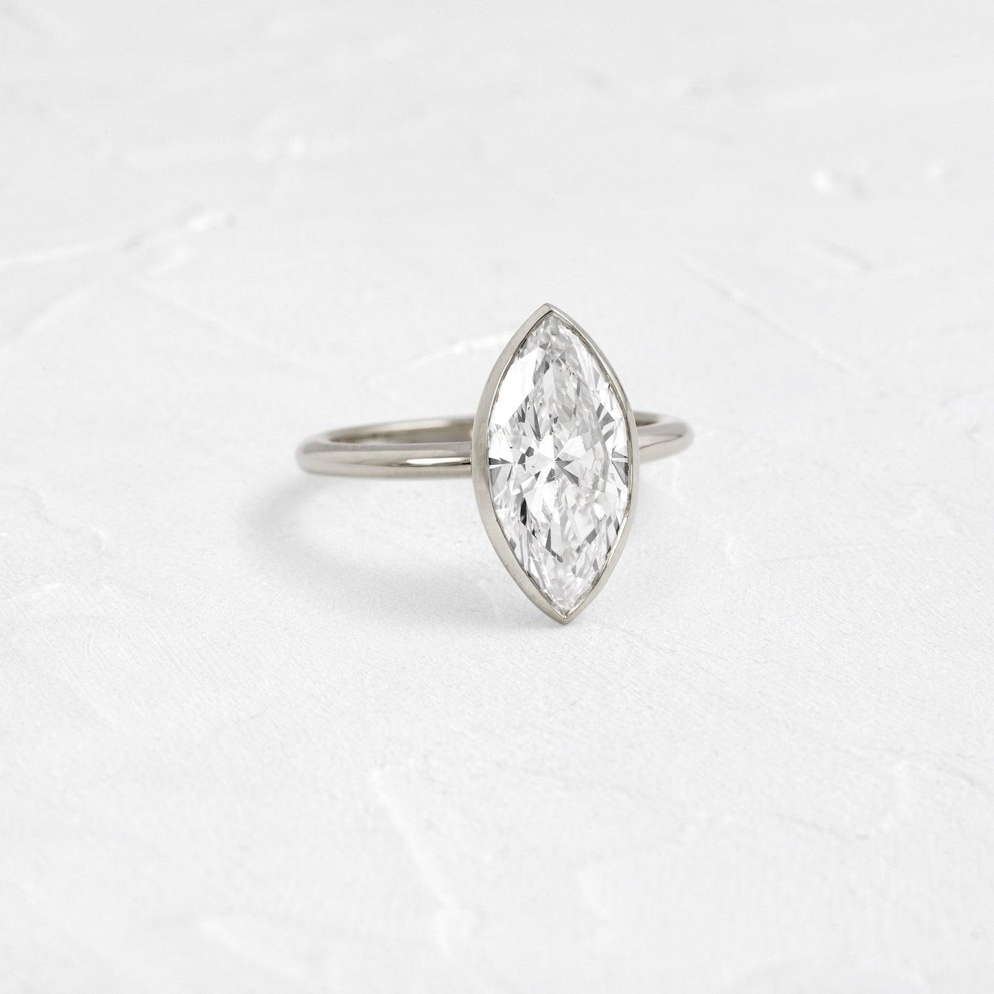 Solitaire Bezel with Hidden Stones-Marquise Lab Grown Diamond Engagement Ring