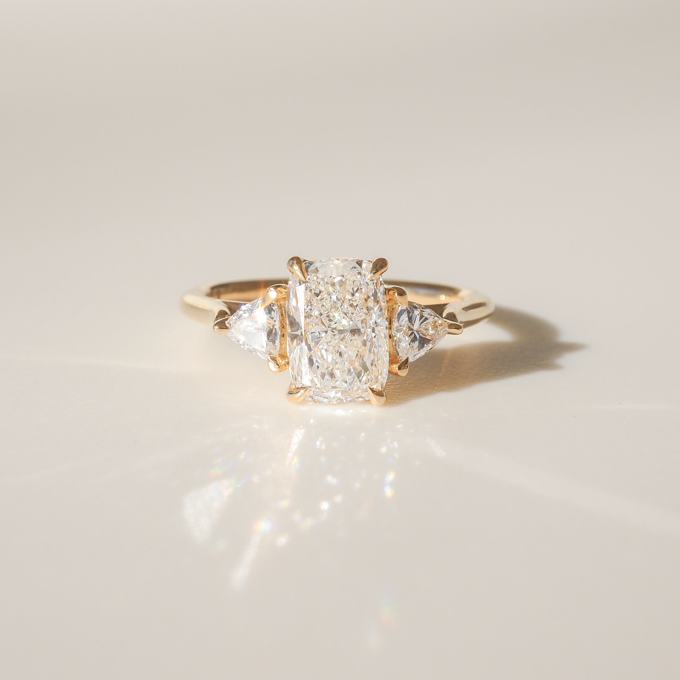 1.70 CT Cushion Cut Lab-Grown Diamond Three Stone Engagement Ring in Gold