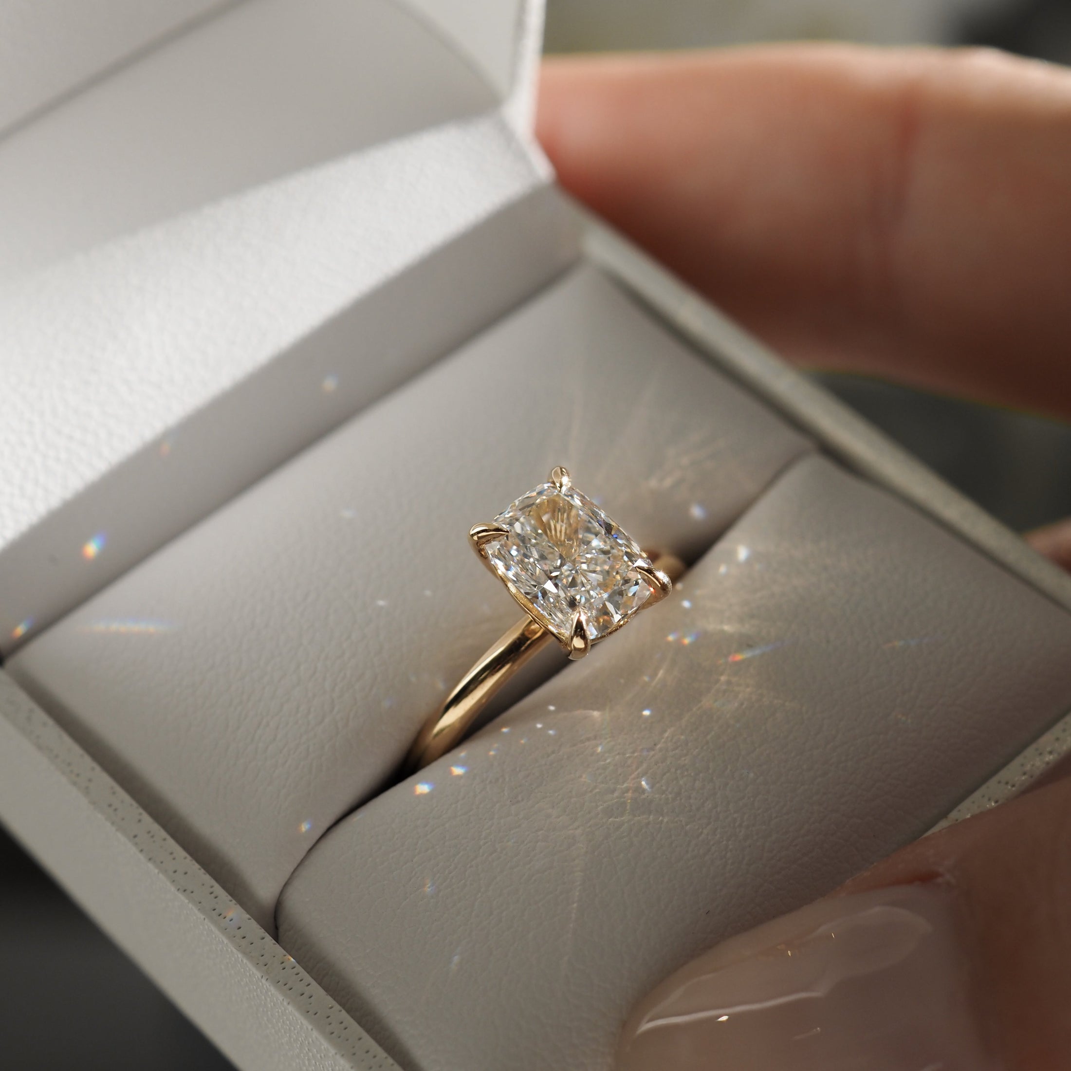 1.50 CT Elongated Cushion Lab-Grown Diamond Solitaire Ring in Gold.