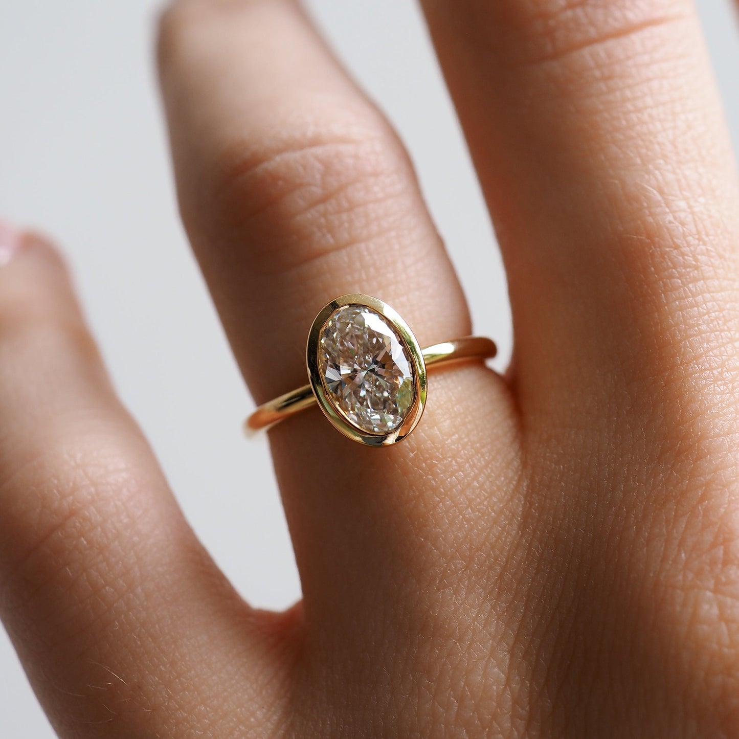 1.50 CT Oval Lab Grown Diamond Bezel Set Engagement Ring in Yellow Gold 2