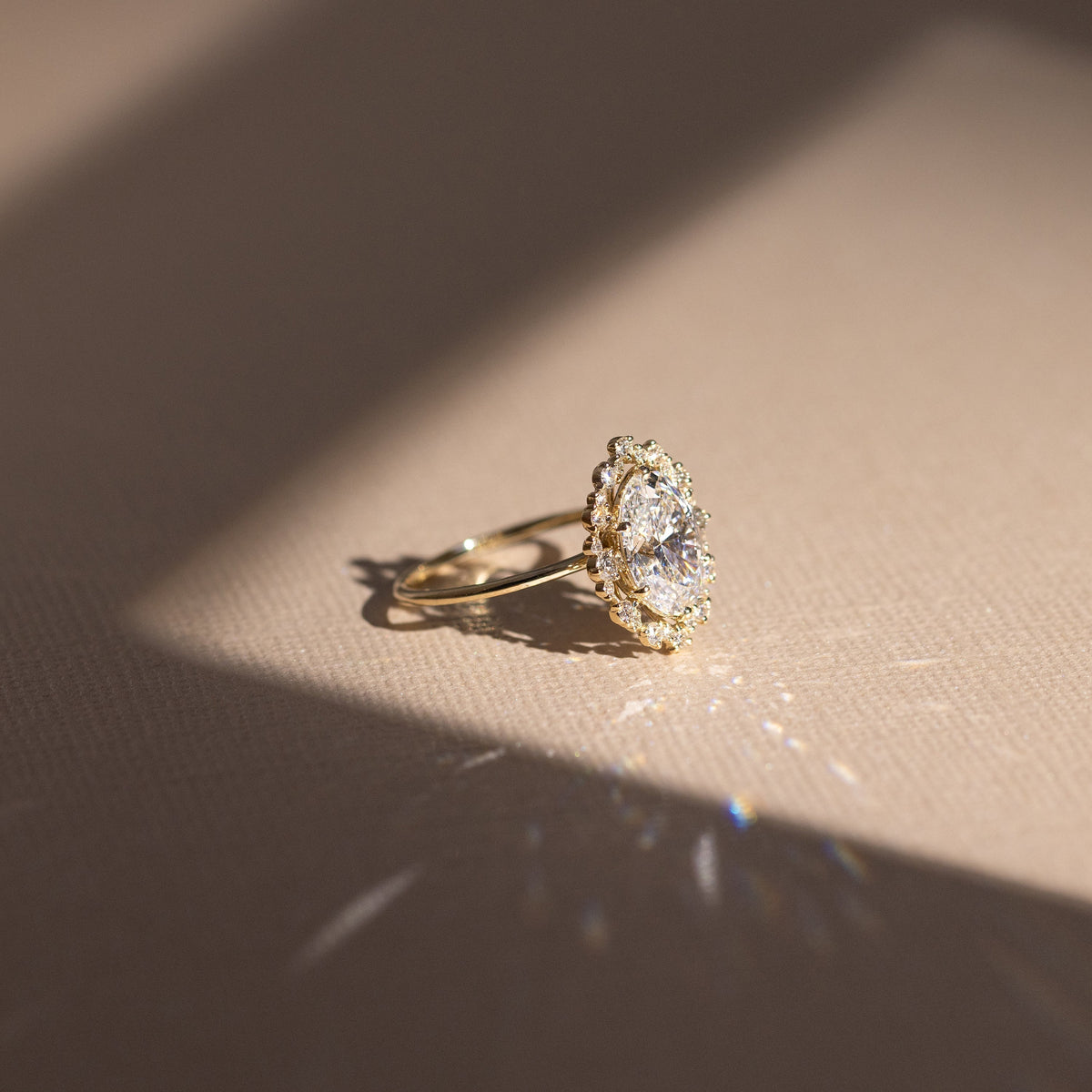 Graduated Halo-Oval Lab Grown Diamond Engagement Ring