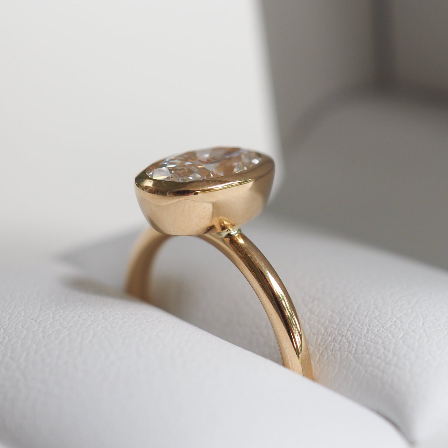 1.50 CT Oval Lab Grown Diamond Bezel Set Engagement Ring in Yellow Gold 3