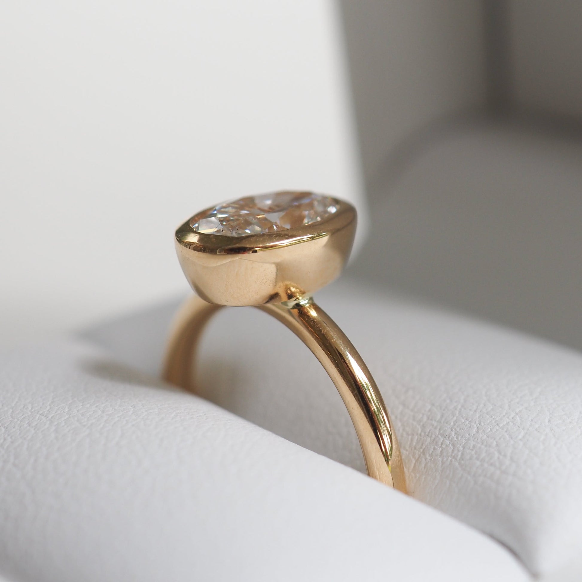 1.50 CT Oval Lab Grown Diamond Bezel Set Engagement Ring in Yellow Gold 3