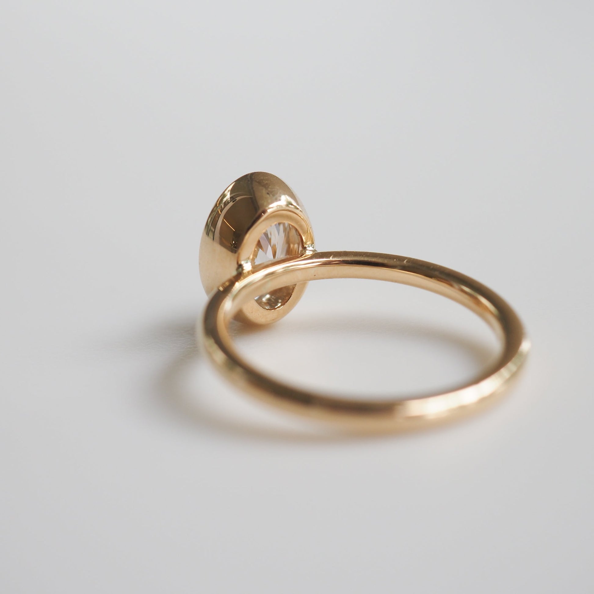 1.50 CT Oval Lab Grown Diamond Bezel Set Engagement Ring in Yellow Gold 5
