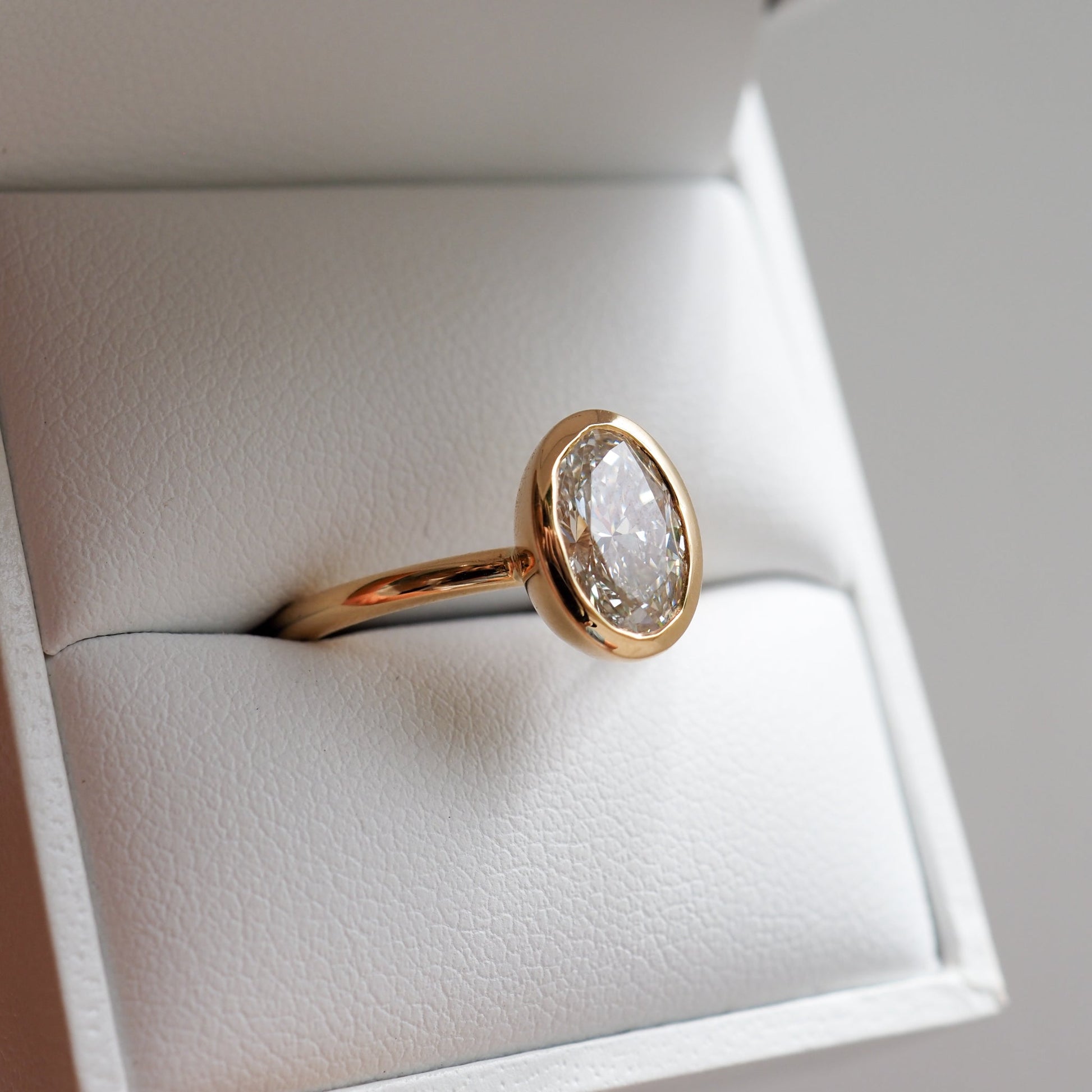 1.50 CT Oval Lab Grown Diamond Bezel Set Engagement Ring in Yellow Gold 4
