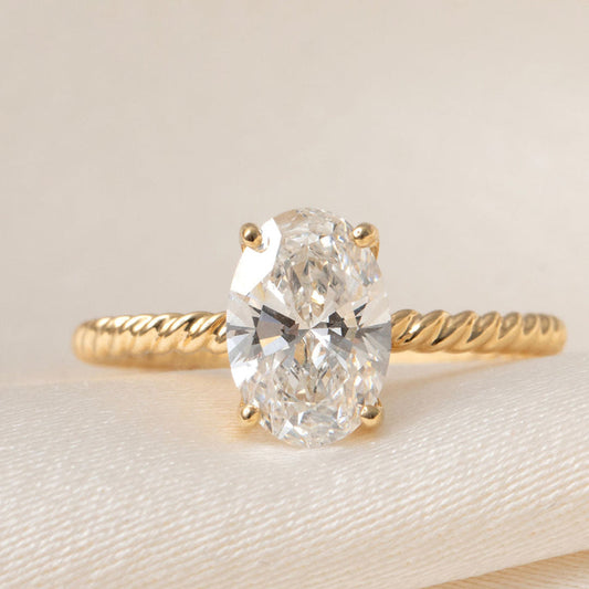 Solitaire & Twisted Shank-1.5 CT Oval Lab Grown Diamond Engagement Ring