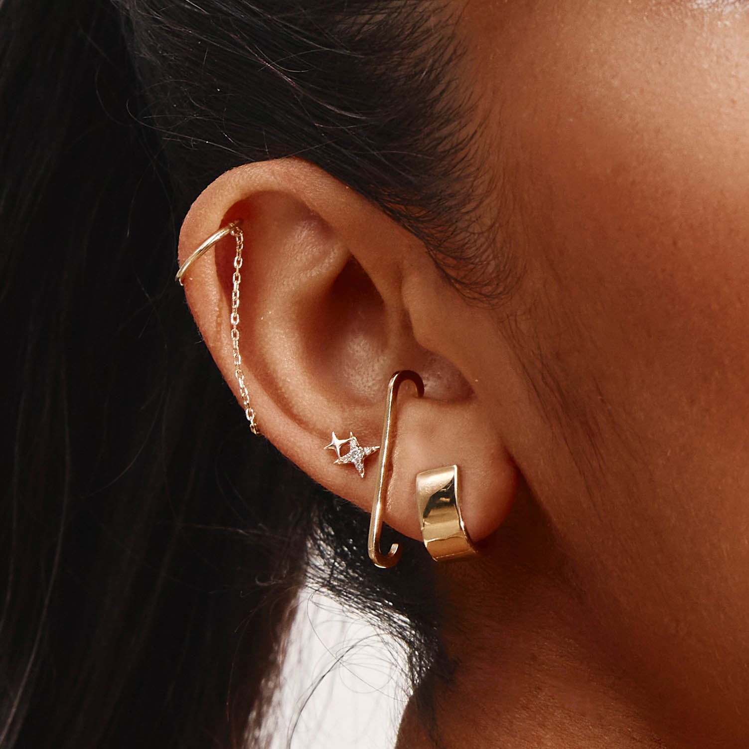 Sleek U-Shaped Gold Huggie Earrings