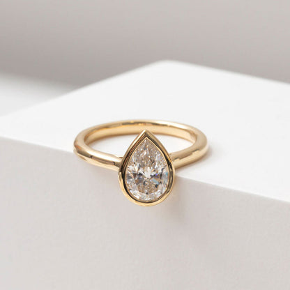 Solitare & Bezel-1.5 CT Pear Lab Grown Diamond Engagement Ring