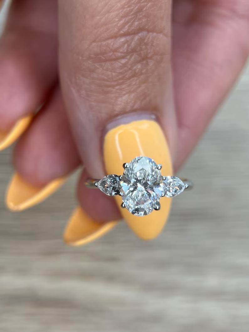 1.5 CT Oval Lab-Grown Diamond Trio Elegance Engagement Ring 1