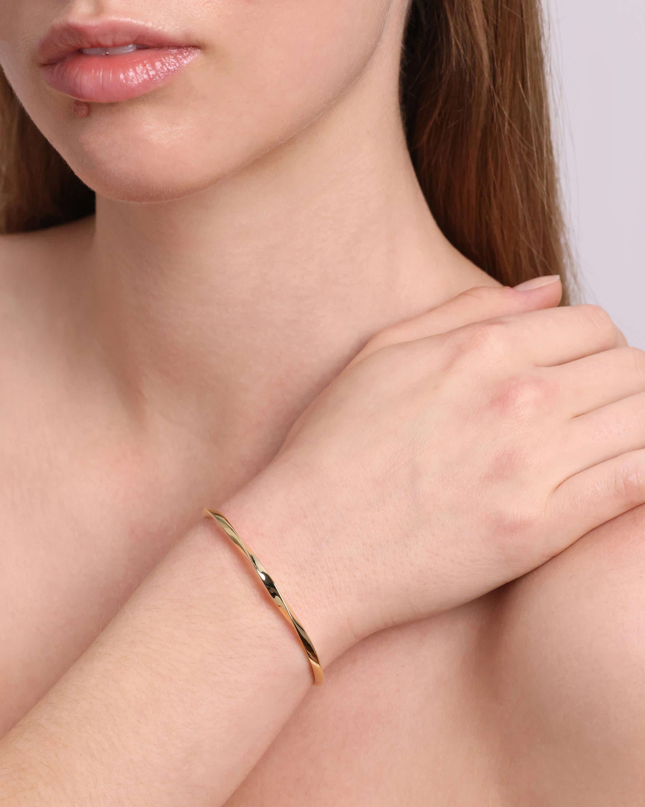 Golden Twisted Elegance Bangle Bracelet