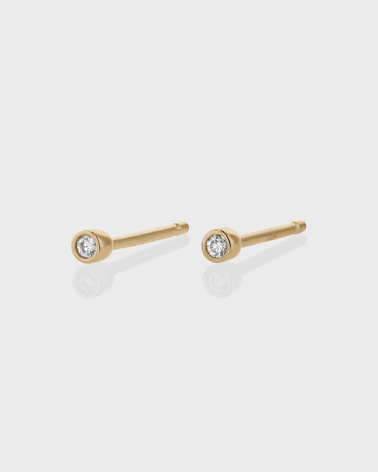 0.05 TCW Round Lab Grown Diamond Gold Bezel Stud Earrings 1
