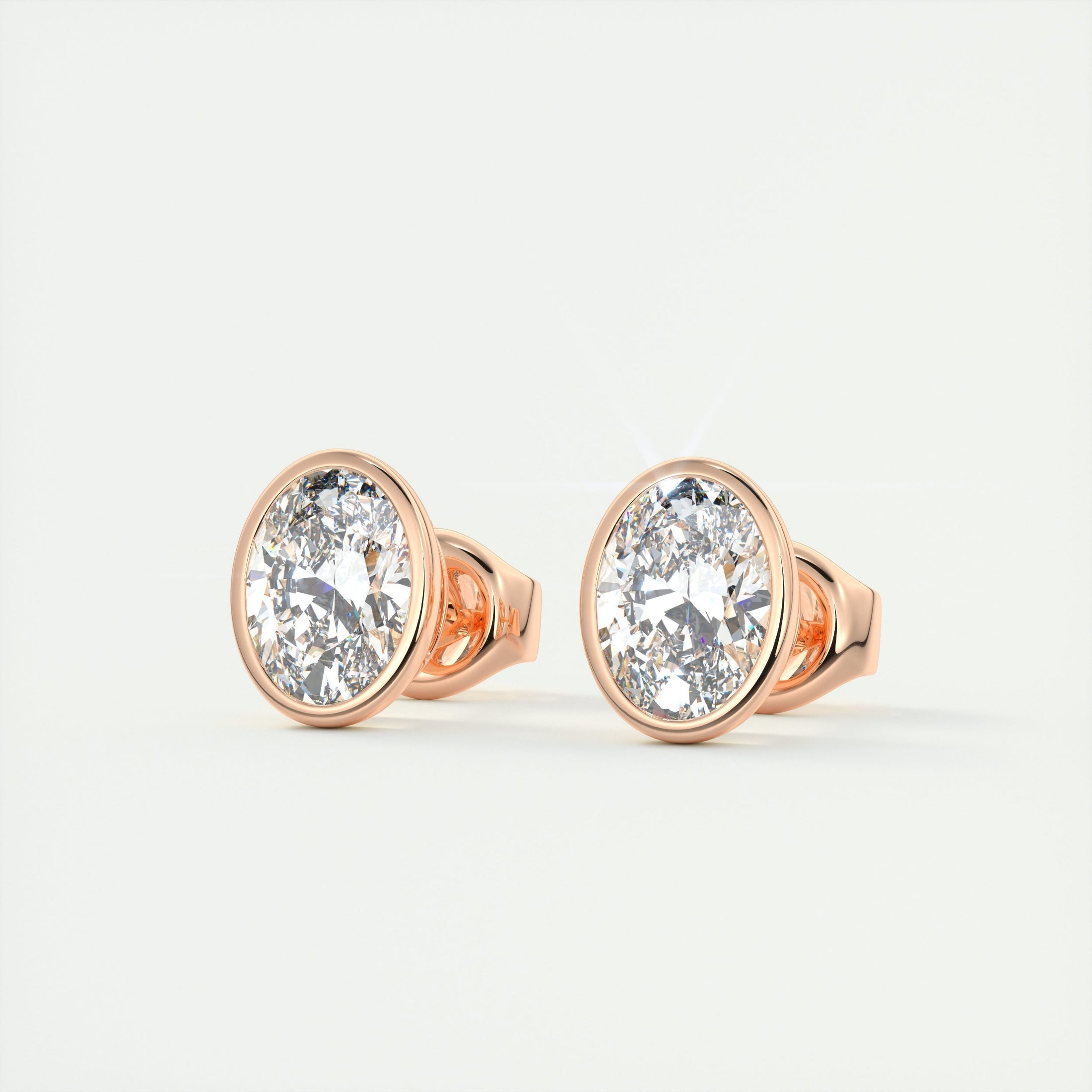 1.0 TCW Oval Lab Grown Diamond Bezel-Set Stud Earrings