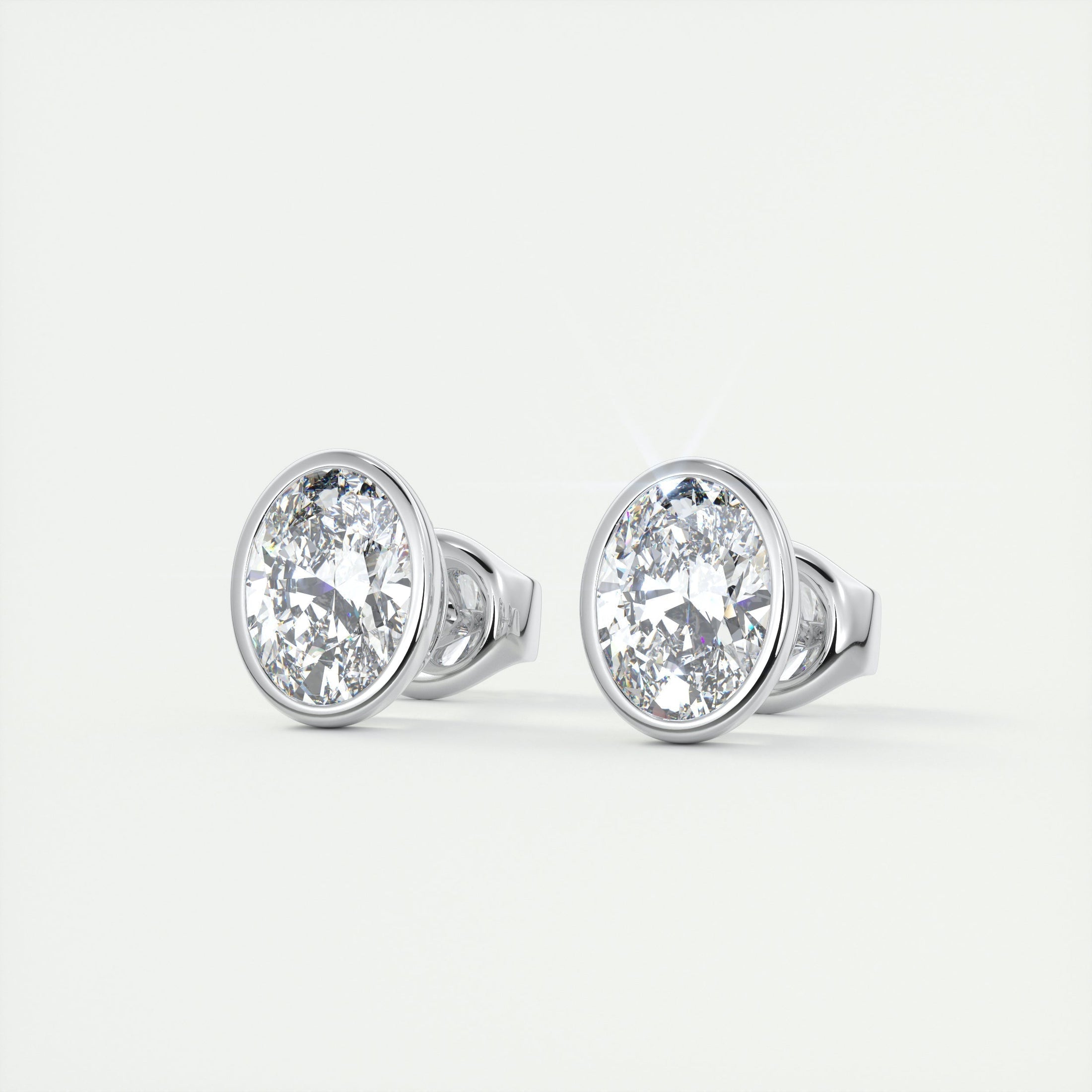 1.0 TCW Oval Lab Grown Diamond Bezel-Set Stud Earrings