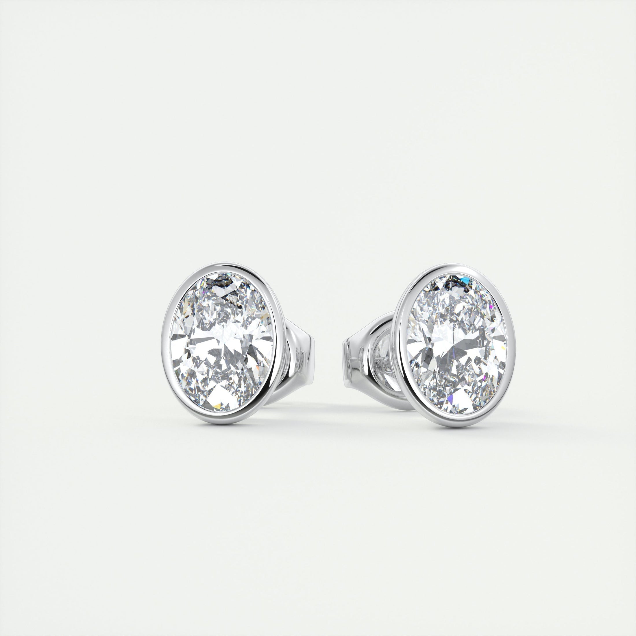 1.0 TCW Oval Lab Grown Diamond Bezel-Set Stud Earrings